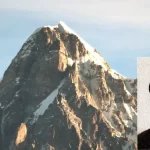 O cume de uma montanha com uma foto do poeta brasileiro Laurindo Rabelo