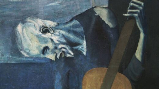 Pintura "O Velho Violinista", de Pablo Picasso. Mostra um homem, em tons azuis que remetem a tristeza, olhando para baixo enquanto toca um violão, com semblante triste.